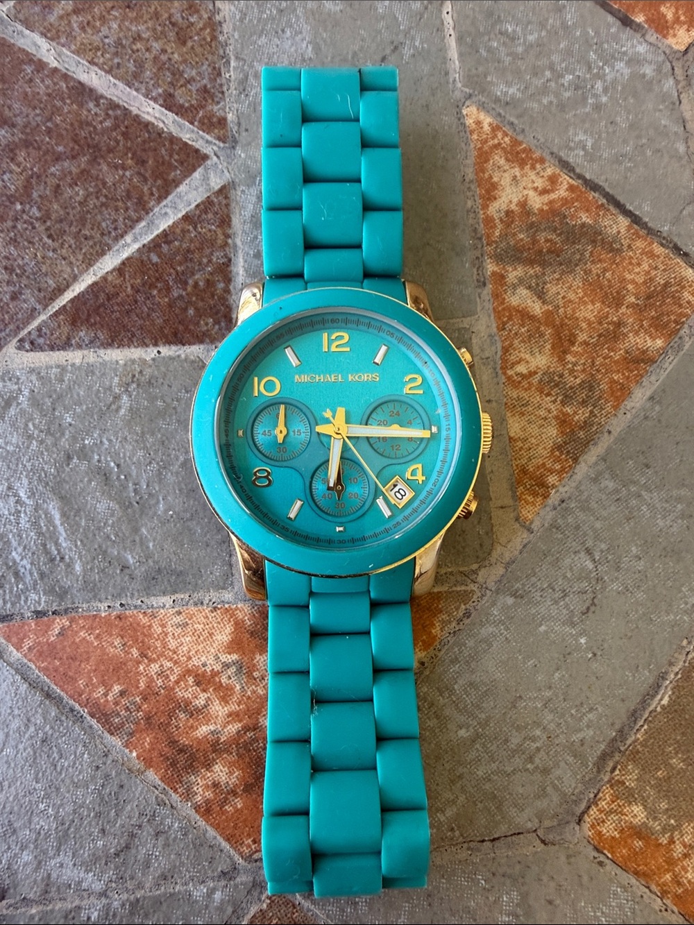 Watch on tiled surface